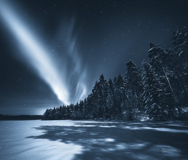 Aurora Borealis Illuminates Sky Over Lake