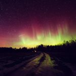 Aurora Borealis Shining Over Icy Road