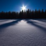 Bright Sun Shining On Snowy Field