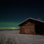 Cabin In Snowy Field