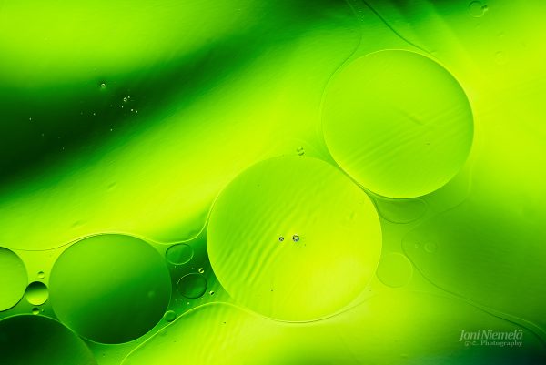 Close Up Of Green Liquid Filled With Bubbles