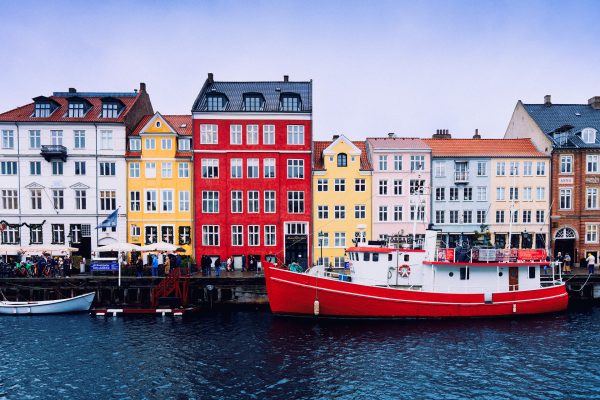 Colorful Historic Buildings Along Nyhavn Waterfront In Copenhagen On A Clear Day