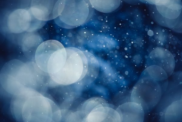Ethereal Blue Bokeh Lights Shimmering Against A Cold Backdrop