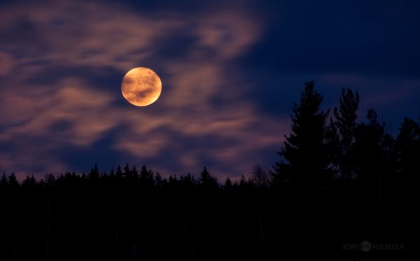 Full Moon Peeking Through Clouds
