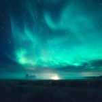 Green And Blue Aurora Borealis Illuminating The Sky