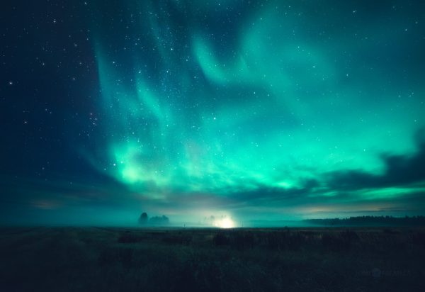Green And Blue Aurora Borealis Illuminating The Sky