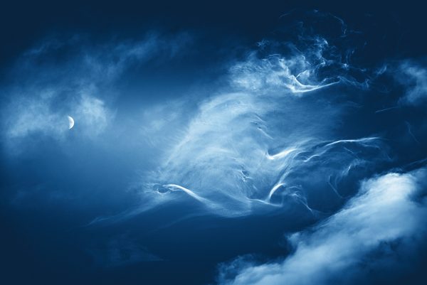 Half Moon In Blue Sky With Clouds