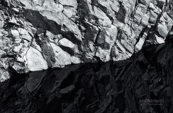 Jagged Rock Face In Monochrome