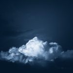 Large Cloud Hovering In Dark Sky