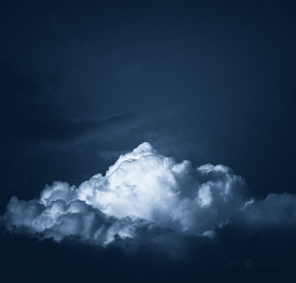 Large Cloud Hovering In Dark Sky