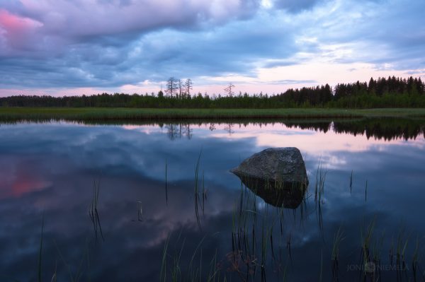 Large Rock In The Center Of Lake