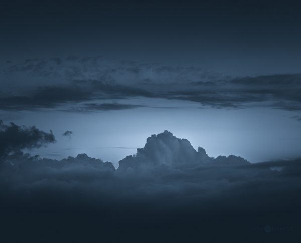 Majestic Thunderstorm Illuminated By Lightning Over Ocean At Night