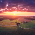 Aerial View Of Sunset Over Field