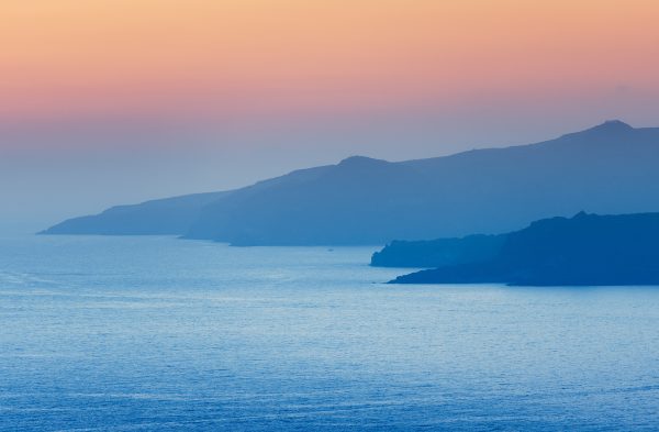 Santorini’s Harmonious Sea At Sunset